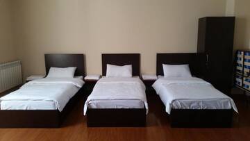 Фото номера Четырехместный номер с балконом Отель Benefice Mini-Hotel &amp; Tours г. Ереван 10